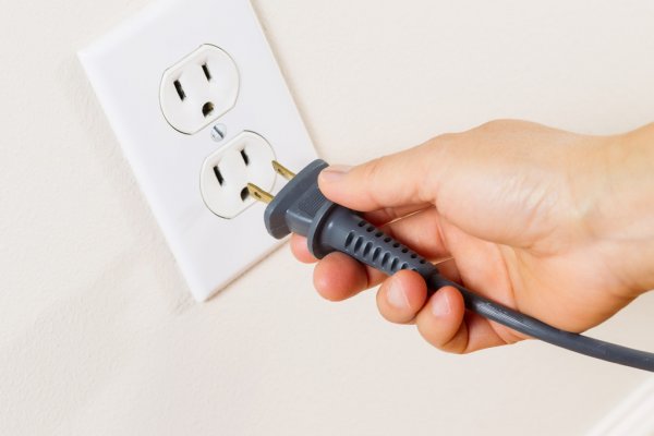 depositphotos_32932189-stock-photo-inserting-power-cord-receptacle-in